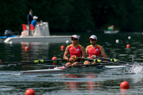 Two men rowing in the water.